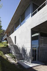 Staircase and Concrete Tread The lower level has its own separate entrance for privacy.  Photo 4 of 12 in A Concrete Abode in Uruguay Embraces its Beachfront Setting