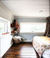 Kids Room, Bed, Dark Hardwood Floor, Girl Gender, and Bedroom Room Type "Seeing our daughter grow up in such a special place brings us a lot of joy. She’s able to explore the world around her and discover a sense of wonder and freedom for herself," says Fishbeyn.

  Photos from A California Couple Customize Their Tiny Home With Multi-Layered Interiors