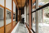 Hallway and Concrete Floor Mizumoto transformed one of the original Japanese-style rooms into a garden that references the house’s past as a rice field farmhouse.  Photo 9 of 16 in Before & After: An Old Japanese Farmhouse Gets a Modern Facelift