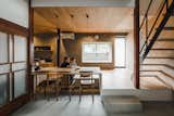 Dining Room, Concrete Floor, Pendant Lighting, Medium Hardwood Floor, Table, and Chair This 7,072-square-feet, two-story house consists of 80 tsubos, which were re-organized to accommodate modern living.   Photos from Before & After: An Old Japanese Farmhouse Gets a Modern Facelift