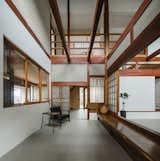 Elements from traditional Japanese architecture such as warm wood, exposed beams, and shoji screen-style sliding doors characterize the home.