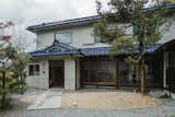 Exterior, Tile Roof Material, House Building Type, and Farmhouse Building Type The facade of the house in Ritto maintains traditional elements.  Photo 1 of 16 in Before & After: An Old Japanese Farmhouse Gets a Modern Facelift