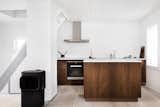 The custom-designed kitchen worktops and cabinetry have been handcrafted by Copenhagen furniture makers København Møbelsnekkeriet.