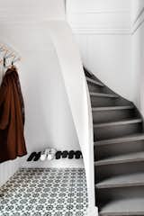 On the first floor is a tiled entrance foyer with nifty storage space for jackets and shoes. Saunders retained the home's original staircase, which connects the first two floors.