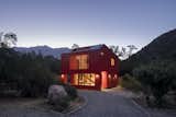 Exterior, Prefab, Small Home, House, Saltbox, Metal, and Metal The houses in this area are very isolated, with no visual contact between houses.  Exterior Prefab House Small Home Photos from This Modular Home in Chile Has Us Seeing Red—in a Good Way