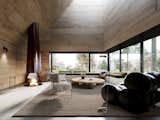 Living Room, Concrete Floor, Rug Floor, Bench, Coffee Tables, Chair, and Wood Burning Fireplace The armchair is by Ricardo Fasenello.

  Photo 4 of 12 in Five Modular Cabins Form a Sculptural Catskill Abode