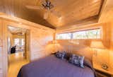 Bedroom, Night Stands, Light Hardwood Floor, Bed, and Wall Lighting One of the available models—the ESCAPE Traveler XL—is available to rent for $195 per night or $1,365 per week. 

  Photo 6 of 10 in The Largest Tiny Home Resort in the Midwest Is Now Open