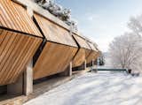 Doors, Exterior, Wood, and Folding Door Type The exterior wood slat doors can fold inwards like wings to create eave-like shelters.  Photos from Art Studio