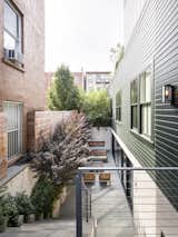 This second-floor extension, which is clad in zinc, rises from the rear of the building.
