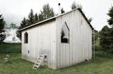 Exterior, Gable RoofLine, Metal Roof Material, Cabin Building Type, Wood Siding Material, and Small Home Building Type The chalet is built entirely out of Jura forest Fir wood planks.  Photo 2 of 12 in An Outdated Swiss Chalet Is Treated to a Playful New Look