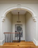 Staircase, Wood Tread, and Wood Railing Art by Time Hussey.  Photo 4 of 21 in An Old Charleston Row House Is Elegantly Modernized With a Southern Twist