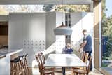 Dining, Pendant, Table, Chair, Light Hardwood, Storage, and Stools The walls, ceilings, windows, and cabinetry were all strategically positioned to unveil views to the outdoors.   Dining Light Hardwood Chair Storage Photos from Wooden Screens Shade This Sustainable Melbourne Residence