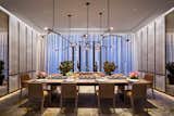 Dining Room, Table, Chair, Medium Hardwood Floor, Rug Floor, and Pendant Lighting Here is a look at the luxurious and stylish dining room.

  Photo 7 of 11 in Tom Brady and Gisele Bündchen's Former Manhattan Apartment Is Listed For $14M