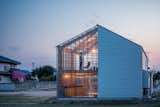 Exterior, Wood Siding Material, House Building Type, Glass Siding Material, Gable RoofLine, and Metal Roof Material  Photos from This Dreamy Japanese Abode Is Part Greenhouse