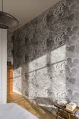 A closer look at the Fornasetti wallpaper in the bedroom.
