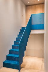 The eye-catching metallic blue staircase was produced by Joe Faller Fabrications.