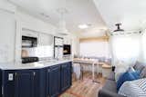 All of the cabinets and walls of the Jayco camper were professionally sprayed with Benjamin Moore Simply White to create a crisp, modern look. Steve and Trina then sanded and wiped down the doors, primed them, and used Alkyd satin paint for the final coating.