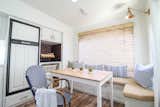 The bench seating with hidden storage turned this rear living area into Trina’s favorite part of the camper home.