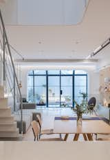 Dining Room, Chair, Table, Ceiling Lighting, and Storage A sunlit, open-plan living room, dining room, and kitchen are located on the first level.  Search “农业银行存款小票图片2019年8月31【专·业·可·靠+V:DK523529】” from A Sunny Stairwell Brings Light to an Old Shanghai Dwelling