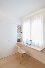 Office, Desk, Light Hardwood Floor, Chair, Study Room Type, and Shelves Oak parquet was used throughout the apartment.  Photo 9 of 12 in A Revamped Modern Home Is Sprinkled With Old-World Charm