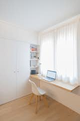 Office, Desk, Light Hardwood Floor, Chair, Study Room Type, and Shelves Oak parquet was used throughout the apartment.  Photos from A Revamped Modern Home Is Sprinkled With Old-World Charm