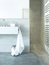 Bath Room and Wall Mount Sink Pedal bin and towel holder from Vipp.  Search “classic pedal bin” from A Stone Retreat in France Gets a Sleek Glass Addition