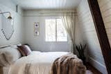 Carefully selected textiles and potted plants give the rooms a warm and cozy feel.