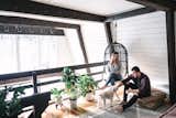 Danielle and Ely Franko relax with their pooch in the loft area.
