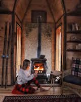 Sara Underwood relaxes by the fireplace in Witzling's fifth cabin.
