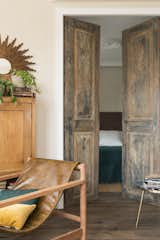 Doors, Wood, Swing Door Type, and Interior A look at the original interior door that was restored.

  Photo 11 of 15 in A 1930s Barcelona Apartment Is Revitalized Into an Airy Abode