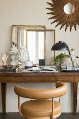 Office, Study Room Type, Chair, Dark Hardwood Floor, and Lamps Accessories from Antique Boutique.  Photos from A 1930s Barcelona Apartment Is Revitalized Into an Airy Abode