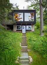 Staircase and Stone Tread “The stone walls, steps, and pathways provide a wonderful warmth and contextual appropriateness to the rugged Northern Minnesota setting,” says founder David Salmela.  Photos from Two Rectangular Volumes Unite to Form a Colorful Lakeside Cabin