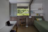One of the three bedrooms has a single bed and a study desk.