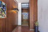 The house is in excellent condition and retains much of its original midcentury form and materials.