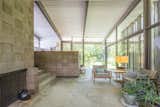 Simple geometric volumes are constructed with glass walls that connect the interiors to the outdoors.&nbsp;