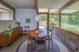 Arranged along a central spine, the Grant House has an open floor plan, a family room, and a kitchen and dining area that merges with a step-down living space.