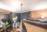 The architects created a lofted sleeping area in order to free up space for the living lounge on the ground floor.

  Photo 5 of 16 in Before & After: A Little Flat in Ukraine Gets a Modern Upgrade