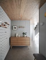 An entryway with perforated walls.