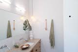 Bath Room, Undermount Sink, Pendant Lighting, Stone Counter, and Ceramic Tile Wall The bathrooms were kept simple and bright.  Photo 8 of 17 in Favorites by Yona Kidron Shalev from A Tiered Home in Los Angeles Hugs a Steep Slope