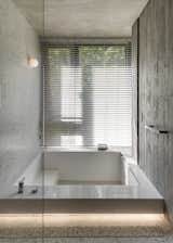 Bath Room and Soaking Tub Various shapes of bespoke lighting have been used to give the interiors a warm, calming atmosphere.

  Photo 15 of 16 in A Couple Embrace Wabi-Sabi Design to Travel Back to the Past