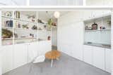 The white kitchen and laundry joinery fold away, making them out of sight when not in use.&nbsp;