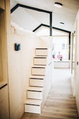 Steps with built-in drawers lead up to the sleeping loft.