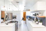 In San Jose, California, interior designer Cathie Hong opens up a dim, confined kitchen to better serve a young family.