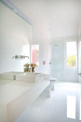 A bright and white bathroom.