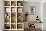 A study boasts built-in shelves for books or decorative vignettes.