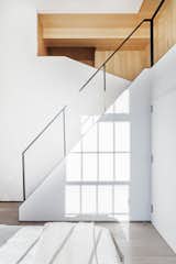Staircase and Metal Tread All the metalwork was done by Kin &amp; Company.  Photo 7 of 14 in A Small Manhattan Home Gains  Space With Two Cozy Lofts