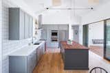 Kitchen, Subway Tile, Pendant, Undermount, Microwave, Wood, Refrigerator, Wall Oven, Dishwasher, Range Hood, Wood, Range, Ceiling, and Medium Hardwood Gray custom cabinetry were created by Shields Custom Carpentry.

  Kitchen Range Medium Hardwood Ceiling Wall Oven Wood Photos from Favorites
