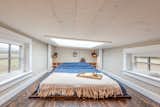 At night, the owners can look up at the stars through the skylight in the lofted bedroom area.