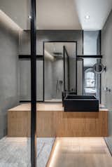Bath, Vessel, Wood, Open, Full, Medium Hardwood, Enclosed, Recessed, and Concrete Tres bathroom accesories.  Bath Open Wood Full Concrete Photos from A Monochromatic Palette Unifies Old and New in This Ukrainian Bachelor Pad