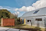 Exterior, Gable RoofLine, Metal Siding Material, Metal Roof Material, and House Building Type The galvanized metal exterior cladding is easy to maintain and will age well over time.  Photo 4 of 19 in Two Barn-Like Volumes Make Up This Low-Maintenance Australian Home